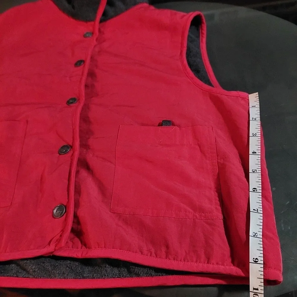 Y2K red vest with dark grey lining.